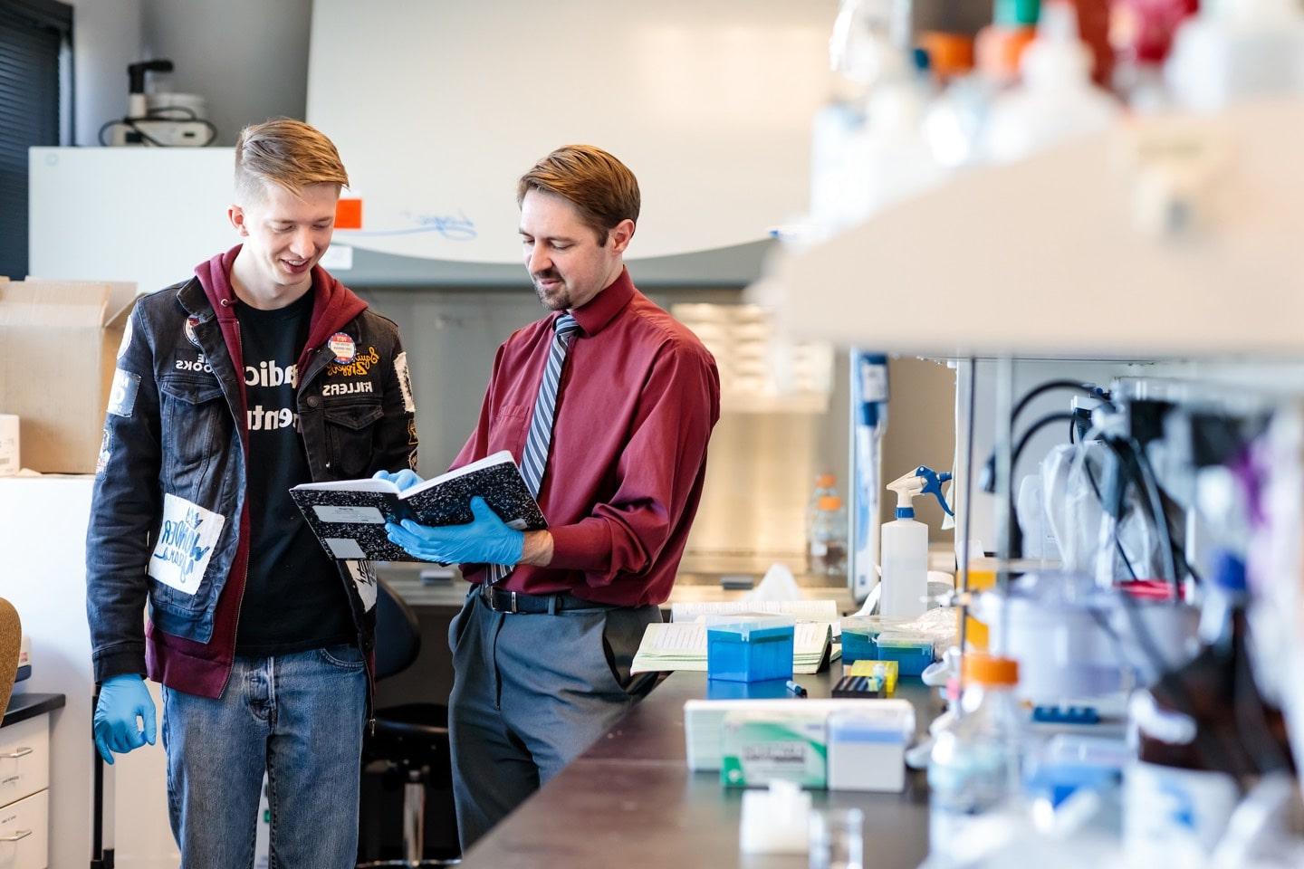 student and teacher in lab